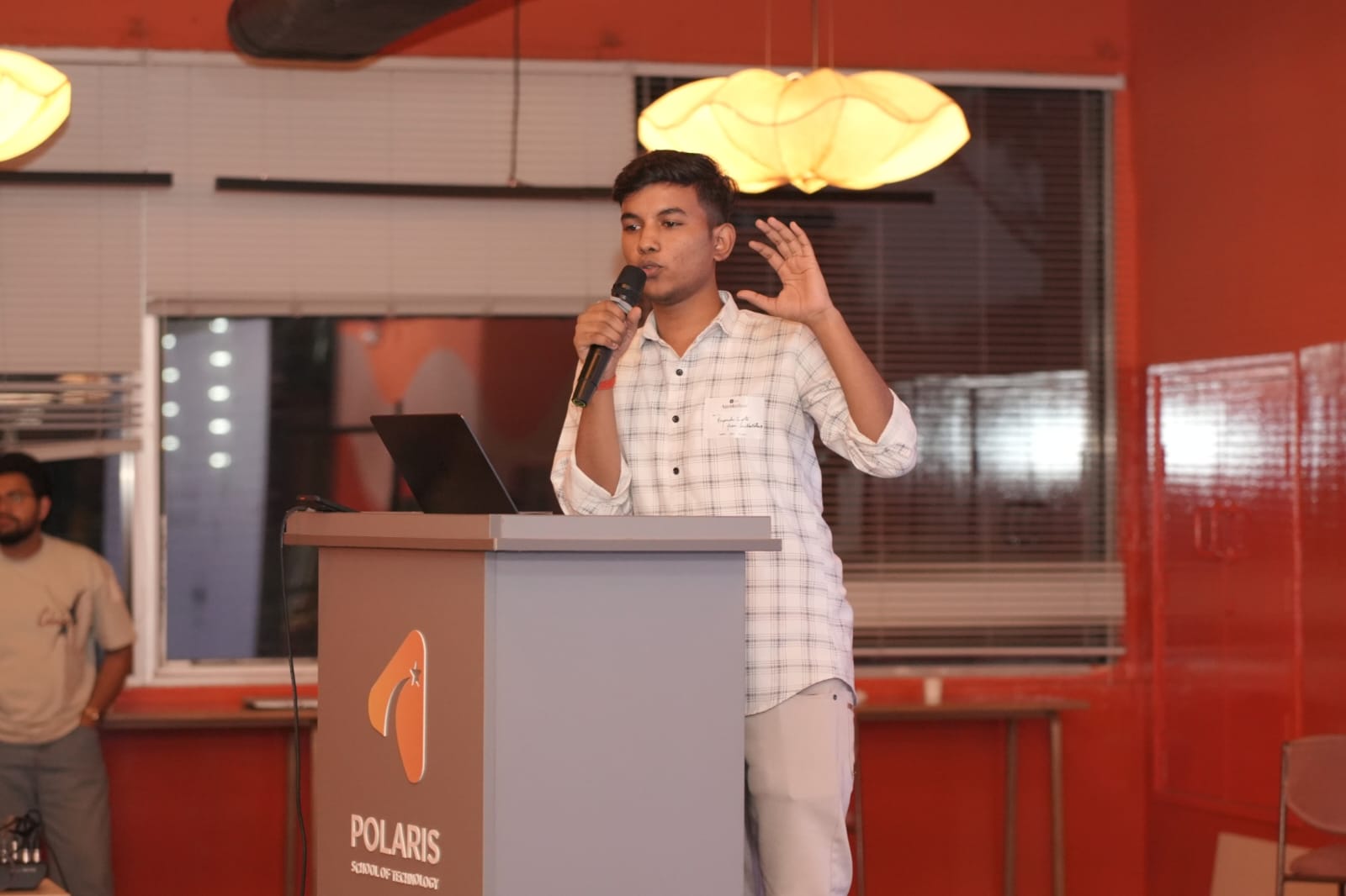 Priyanshu pitching at Lyzr's Agentathon — Polaris podium.