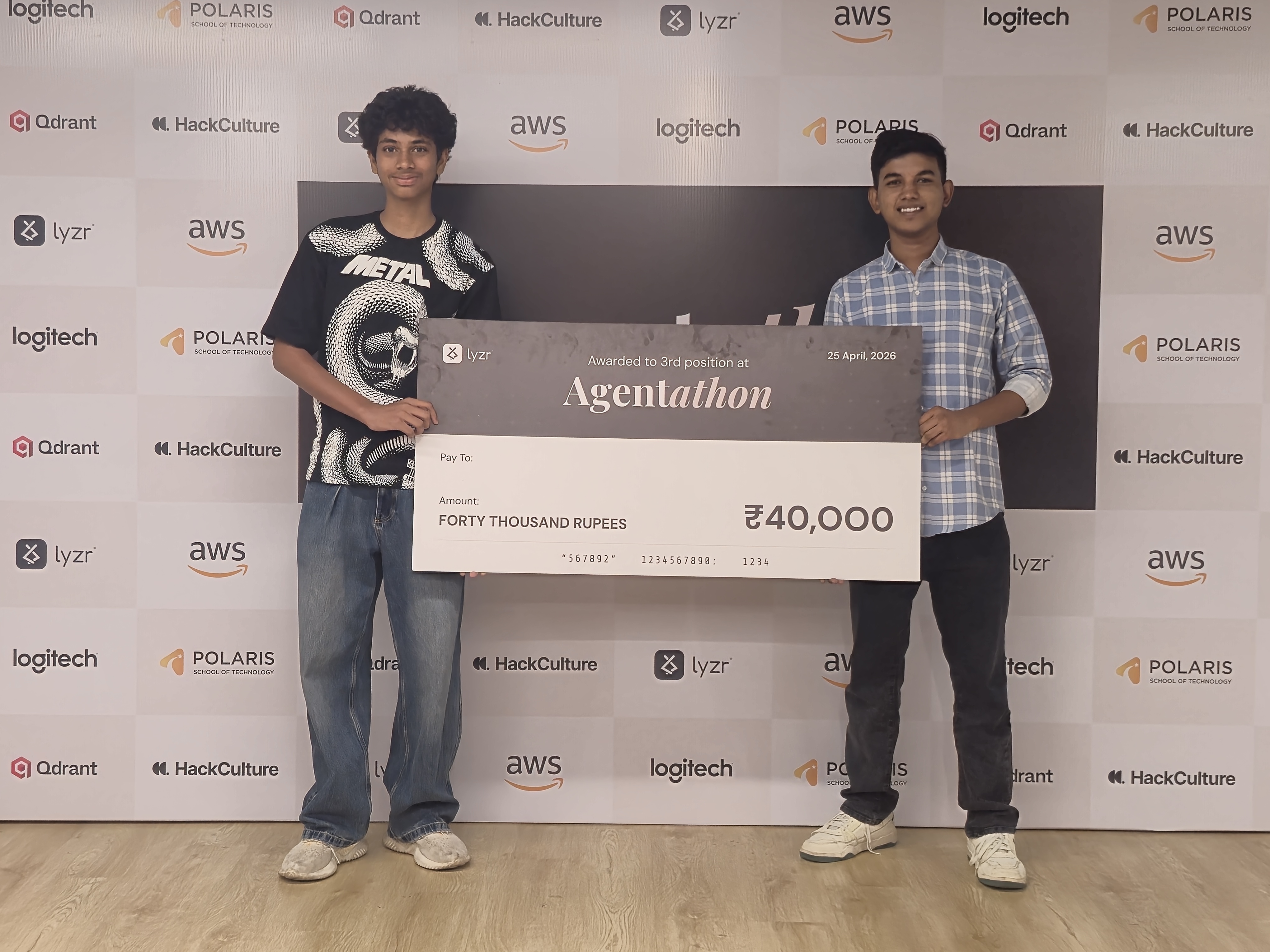 Priyanshu Gupta accepting the third-place cheque at Agentathon by Lyzr.